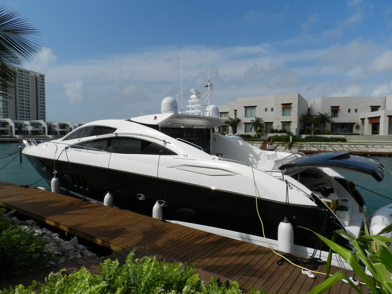 Sunseeker Predator 82 ft bow lounge area with large seating for film production crew and models, Cancun charter