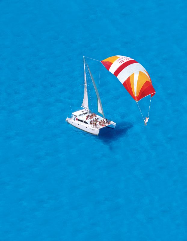 Antares catamaran sailing the turquoise Caribbean on a private group charter near Cancun and Isla Mujeres