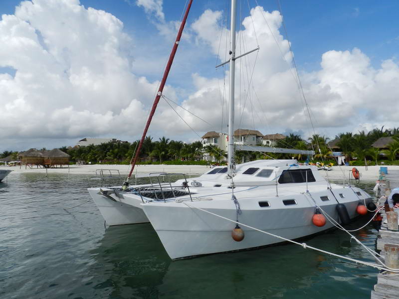Dreamer catamaran sailing along the Maroma coast on the Riviera Maya for private snorkeling and sailing tours