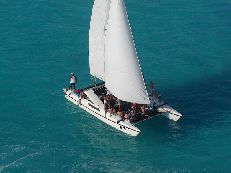 Aerial view catamaran MAR Cancun sailing turquoise Caribbean sea private family group charter vacation