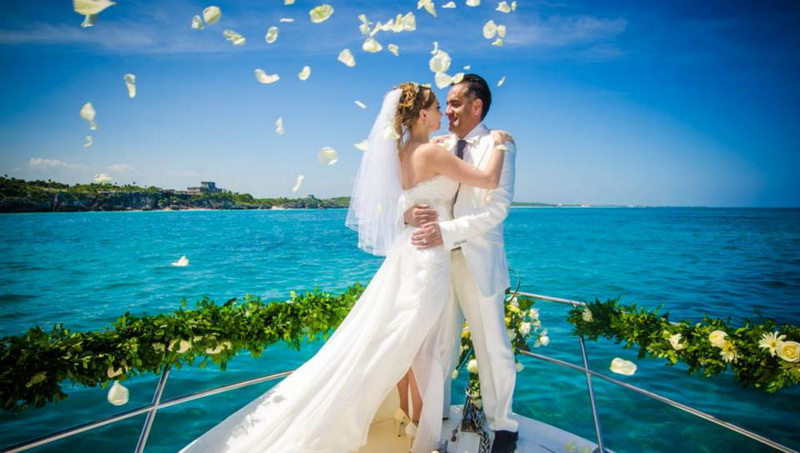 Wedding on yacht front of Tulum ruins